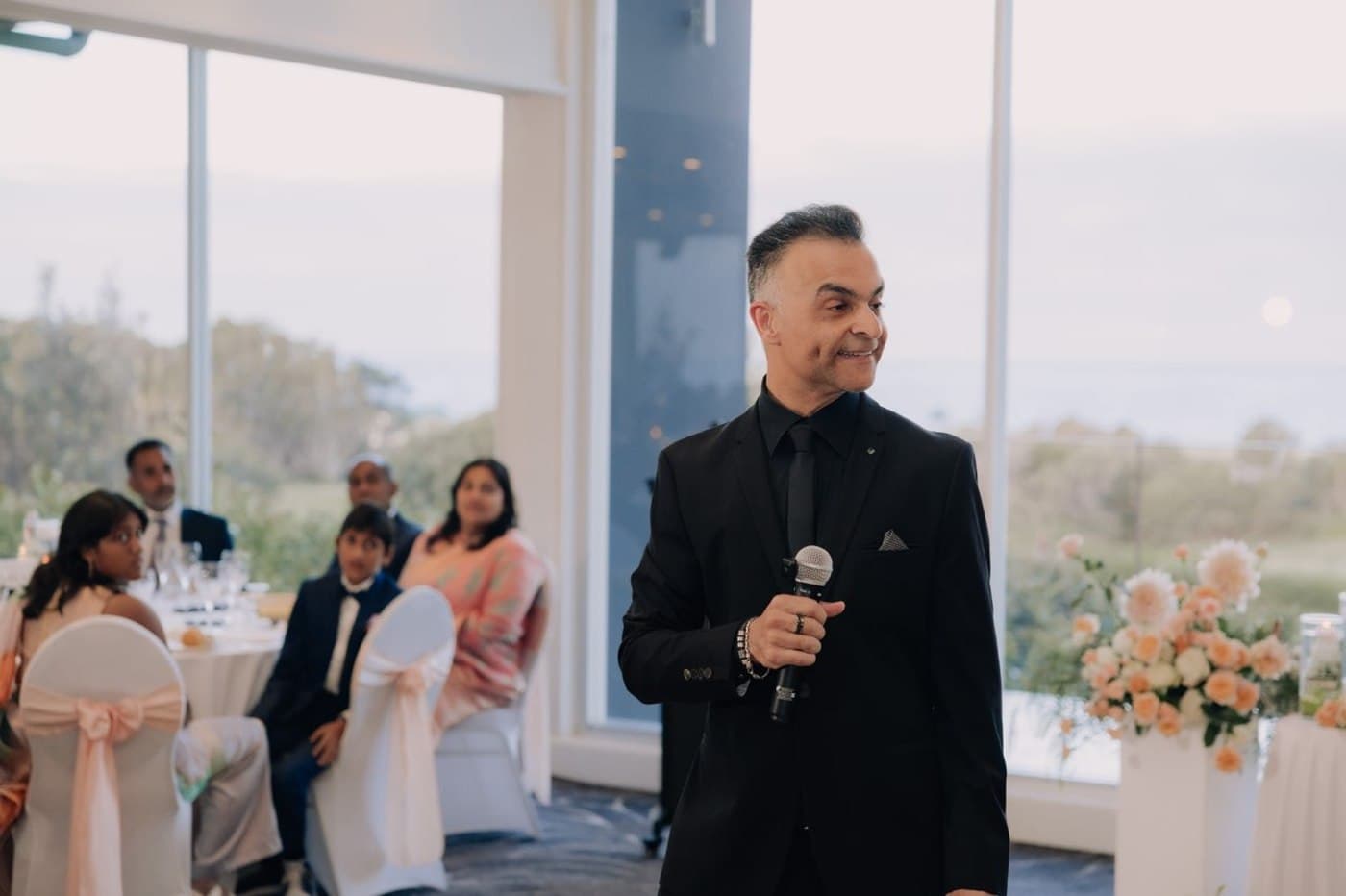 Xavish hosting a wedding reception on the microphone